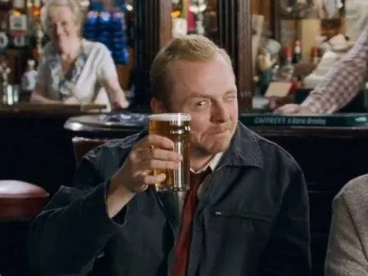 Shaun raising a pint in the Winchester pub, from the 2004 film Shaun of the Dead